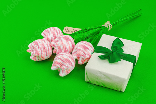 Handmade crochet tulip bouquet with wrapped gift box. Creative spring holiday present, artisan craft