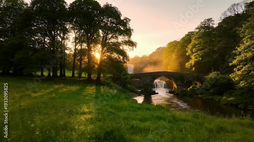 Beautiful sunset over a river and bridge in the countryside.