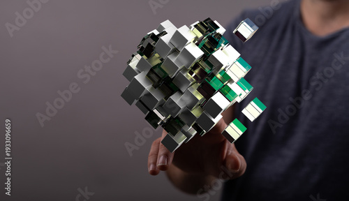 A person touching a 3D cube...
