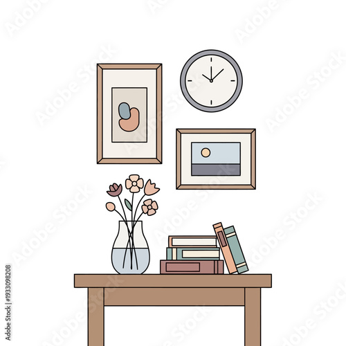 Cozy room corner with framed art, books, flowers, and clock on a table