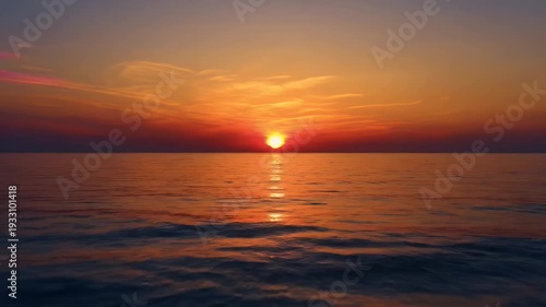 Beautiful sunset over the ocean with vibrant colors and reflections.