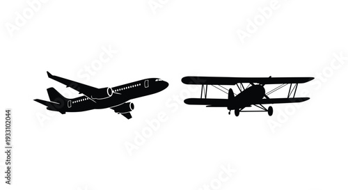 Two aircraft in flight a modern jet and vintage biplane silhouette