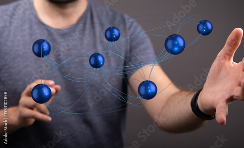 Person touching spheres con...