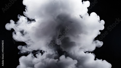 Explosion of white smoke against a black background.