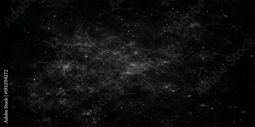 A black and white space background featuring a dark cosmos with stars, a textured nebula cloud, and a light dust explosion across the starry night sky of the astronomy universe