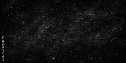 An abstract black and white starfield reveals a dark cosmos where bright starlight and textured nebula dust dance across a cold motion-filled night sky within the milky galaxy universe