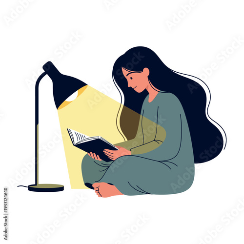 Woman reading a book under a desk lamp in a relaxed pose.