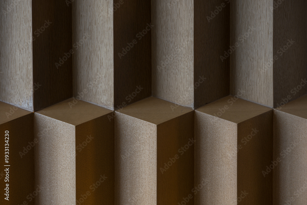 Obraz premium Close-up of wooden geometric three-dimensional lattice structure with textured surfaces and shadow play