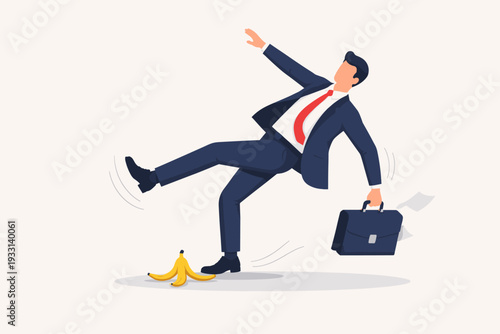Businessman in a Professional Blue Suit Slipping on a Yellow Banana Peel, Losing Balance and Falling Down with a Briefcase, Concept of Business Failure, Risk, Mistake, and Unexpected Obstacles.