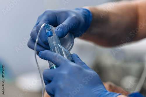 Quadro em tela Anesthesiologist inserting endotracheal tube to induce general anesthesia in sterile operating room