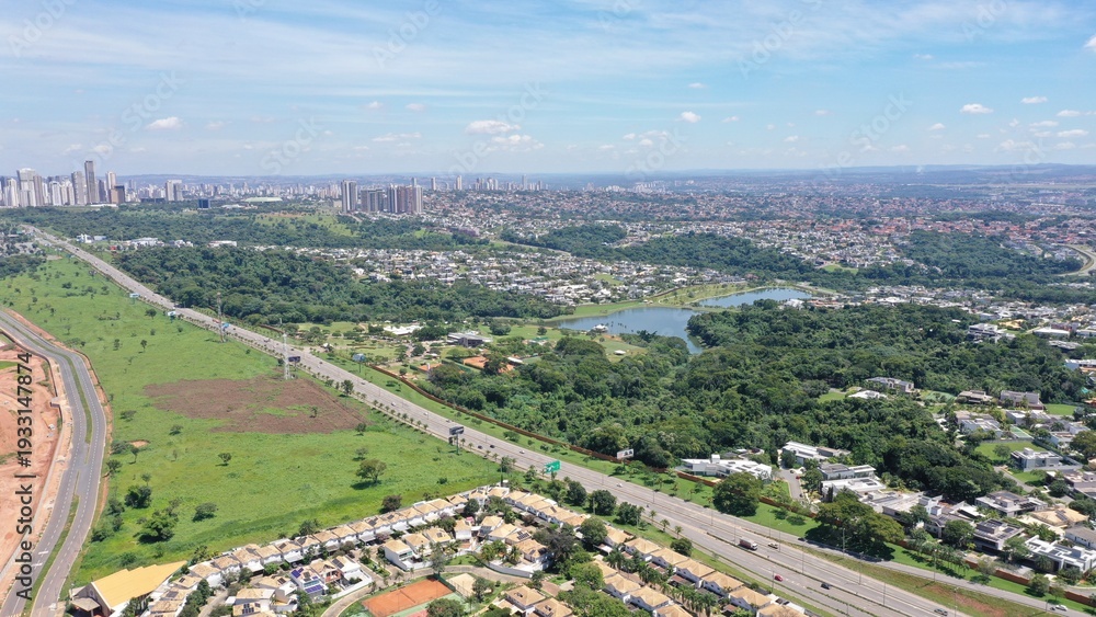 Obraz premium Aerial view of a luxury neighborhood in Goiania with fancy houses, restaurants and lots of nature near the racetrack. Goiania, Goias, Brazil 