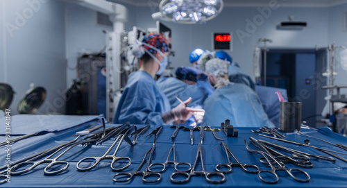 Hospital surgery with team of surgeons wearing sterile gowns and masks. Surgery concept.
