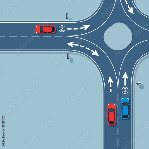 Cars navigating a modern roundabout intersection with traffic flow arrows