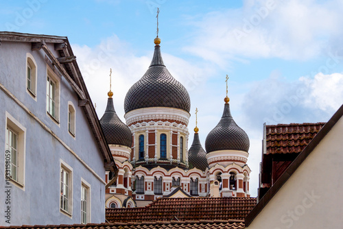 Canvas-taulu View of an ornate orthodox cathedral with dark onion domes rising above old city