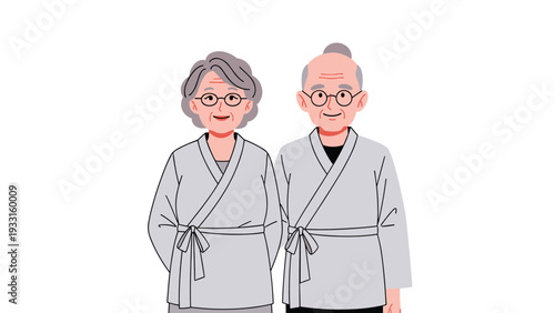 Kind and smiling elderly man and woman standing together wearing traditional gray robes as a symbol of long lasting love and health.