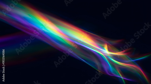 Abstract colorful light streaks flow across a dark background