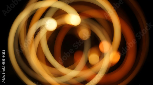 Abstract swirling lights create a dynamic circular pattern in darkness