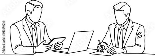 Two men in suits discussing business with a laptop and tablet