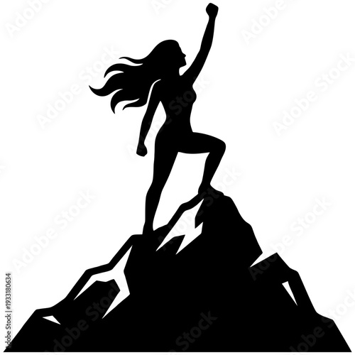 Confident woman standing triumphantly on mountain peak with fist raised