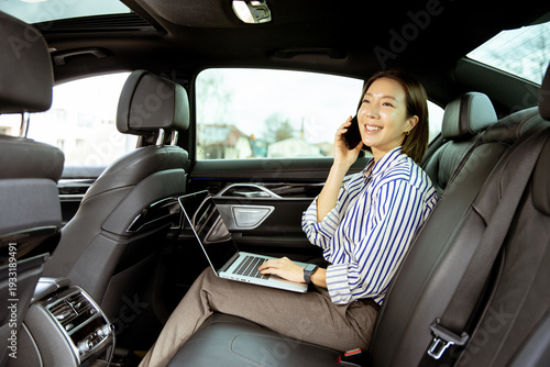 Korean woman talking on pho...