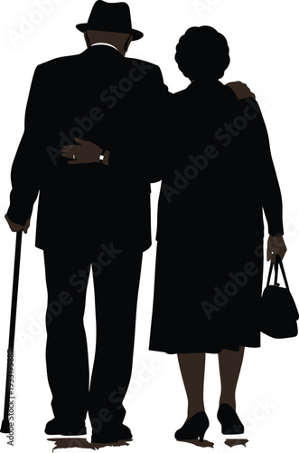 Silhouette of elderly couple walking together
