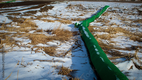green filter sock for best management practices on side near construction. environment and infrastructure or construction design element.