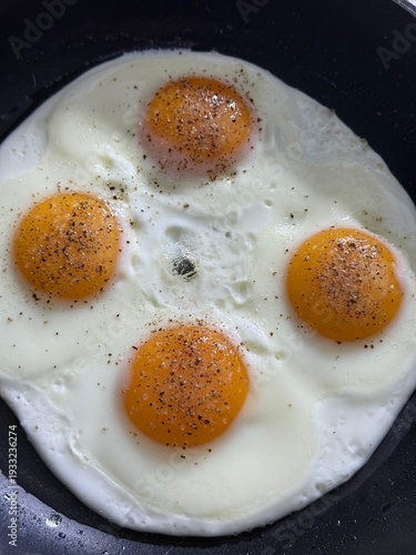 Healthy breakfast with frying eggs
