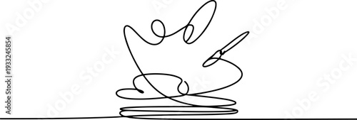 A creative artist's hand holding a paintbrush, poised to create a masterpiece on a canvas, in a minimalist studio setting from a close-up viewpoint