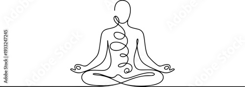 A person meditating in lotus position, illustrating the practice of yoga and mindfulness in a serene environment from a front viewpoint