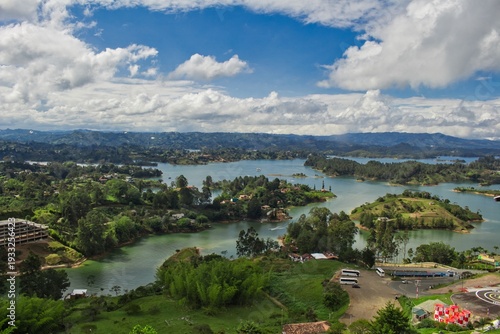 Stunning landscape of El Peñol Stone in Guatapé, Colombia. Iconic monolith with zigzag stairs and panoramic reservoir views. Ideal for travel, tourism, and South American nature photography.