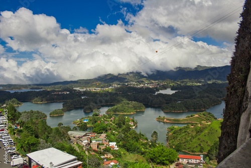 Stunning landscape of El Peñol Stone in Guatapé, Colombia. Iconic monolith with zigzag stairs and panoramic reservoir views. Ideal for travel, tourism, and South American nature photography.