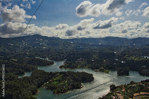 Stunning landscape of El Peñol Stone in Guatapé, Colombia. Iconic monolith with zigzag stairs and panoramic reservoir views. Ideal for travel, tourism, and South American nature photography.