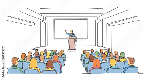 A speaker presenting to a large audience in a lecture hall
