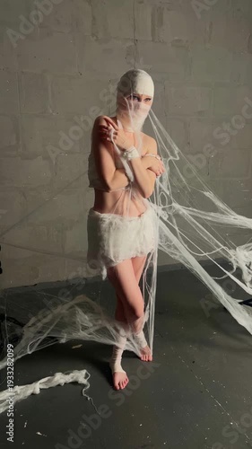Woman in Mummy Costume Performs in Studio