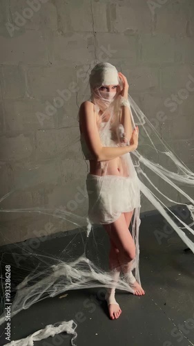 Woman in Mummy Costume Posing for Halloween