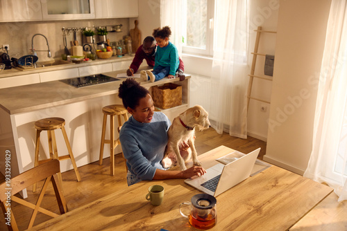 Woman works from home, using a laptop