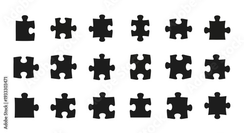 Collection of black puzzle pieces arranged in a grid pattern on a clean surface from a top-down viewpoint