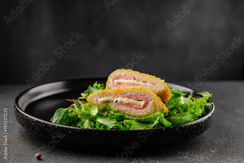 Cordn blue cutlet meat dish chicken fillet, ham, cheese tasty snack fresh gourmet food background on the table rustic food top view copy space keto and paleo diet 