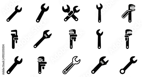 Collection of various wrenches and spanners arranged in a grid pattern on a plain background from a straightforward viewpoint
