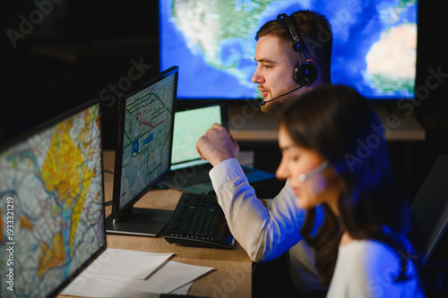 Принти на полотні Dispatch center team managing global logistics operations