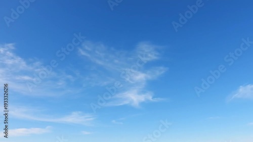 High dynamic range cinematic sky footage wide open blue horizon with thin wispy cirrus clouds and soft cumulus formations drifting slowly steady camera subtle motion natural daylight illumination ultr