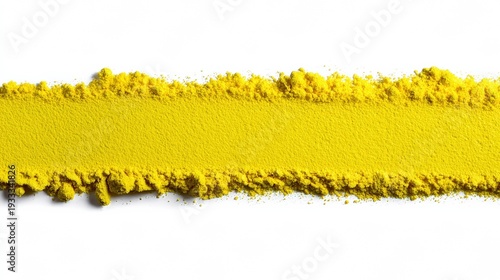 Vibrant yellow powder texture on white background