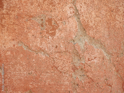 texture of antique pink and burgundy plaster on an ancient wall