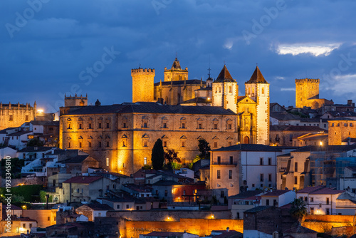 Aerial night view of illuminated historic Caceres