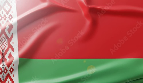 Close-up view of the national flag of Belarus waving in the wind, showcasing its red, green, and ornamental white stripes.