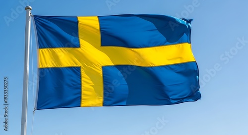 Sweden national flag waving in the wind against a clear blue sky, vibrant blue and yellow Nordic cross design symbolizing Sweeden heritage, identity, pride and Scandinavian culture