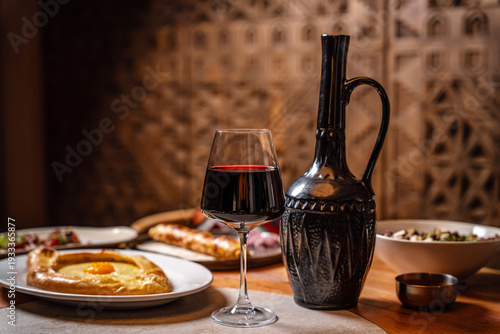 Billede på lærred Red wine with traditional georgian cuisine.