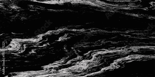 Abstract black and white flowing water motion captures a cascading nature landscape of waves and foam over rocks in a wet river stream