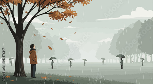 Person standing under autumn tree observing falling leaves.