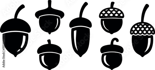 Flat design acorn silhouette icons set eight varied acorn shapes close up simple black vector nature motif autumn collection isolated